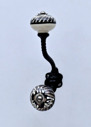 Black and Off-White Swirl Ceramic Knob With Metal Wall Hanger