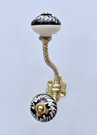 Black and Off-White Swirl Ceramic Knob With Metal Wall Hanger