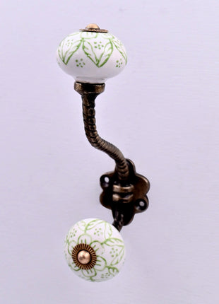Green Floral on White Ceramic Knob With Metal Wall Hanger