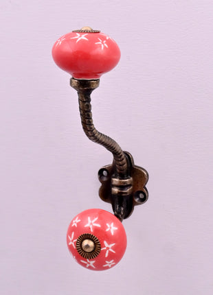 White Starburst on Red Ceramic Knob With Metal Wall Hanger