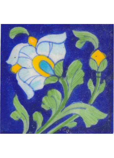 white and yellow flower with green leaves on blue tile 3x3