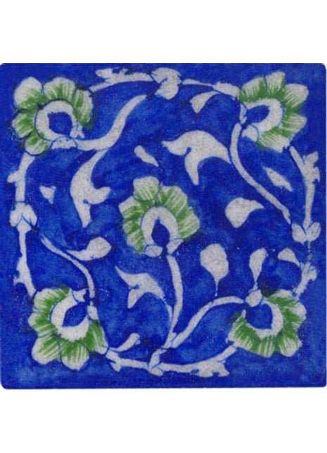 white and green floral design on blue tile 3x3