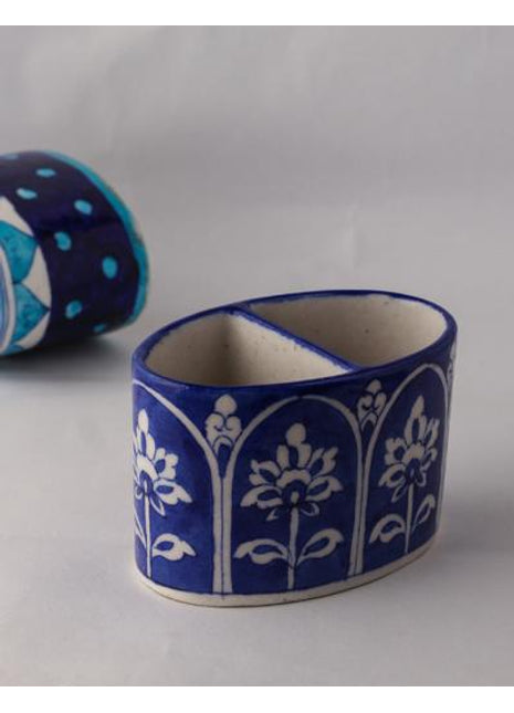 White design on Blue Base Tooth Past Holder