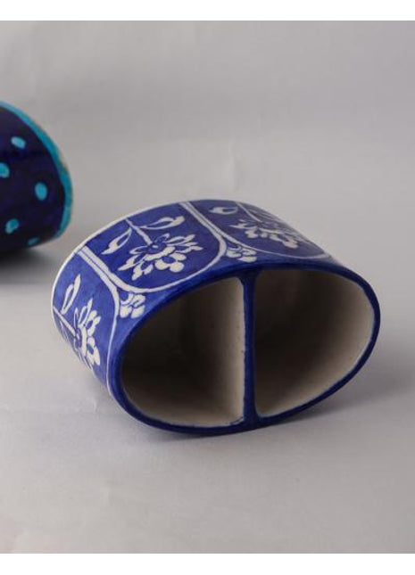 White design on Blue Base Tooth Past Holder