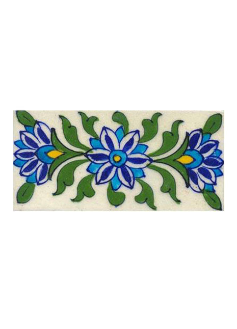 white, blue turquoise flower and green leaves on white tile