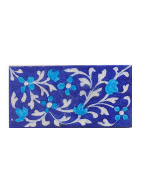 Turquoise flower and blue tile.