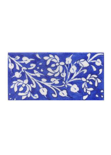White leaves and flower with blue tile