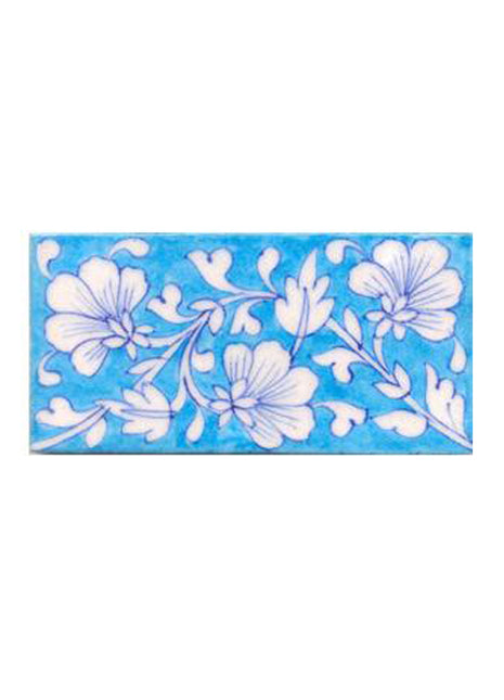 White flower and turqouise tile
