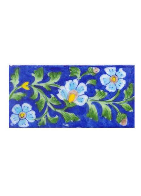 Three turqouise flower and blue tile