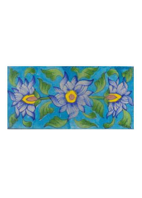 Three blue,yellow,brown and lime green leaves with turqouise tile