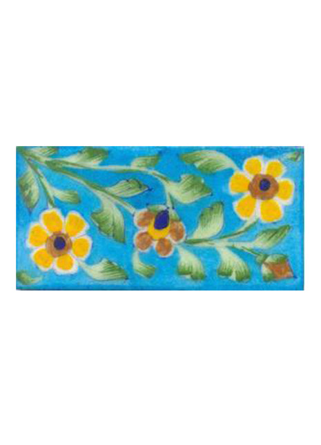 Two yellow and one brown flower and turqouise tile