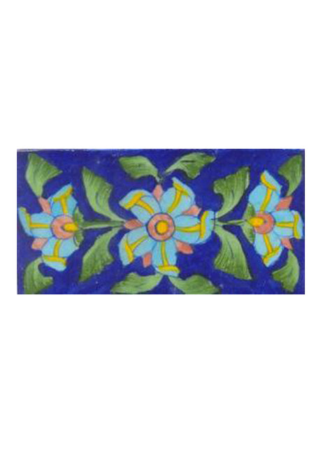 Three turqouise flower lime green leaves with blue tile