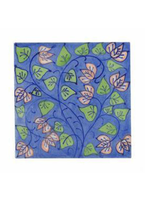 Pink flower and green leaves with blue pottery tile