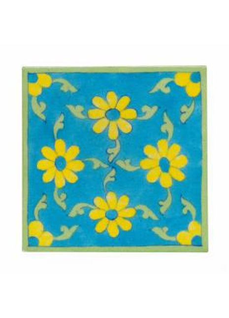 Yellow flower and lime green leaves with turqouise tile