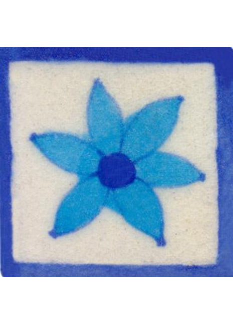 Turquoise flower on white tile