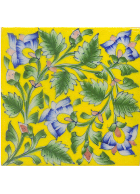 Lime blue flower and lime green leaves with yellow tile