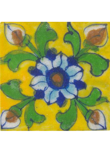 Blue, white , green flower on yellow tile