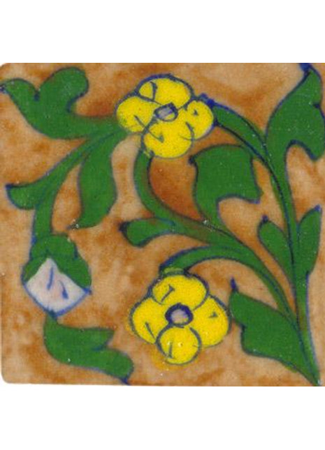 brown tile with green leaves and yellow flower