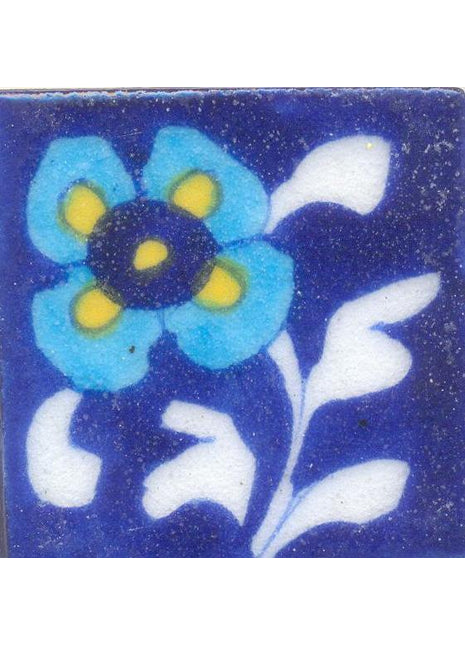 Turquoise and Yellow flower With White Leaves On Blue Base Tile