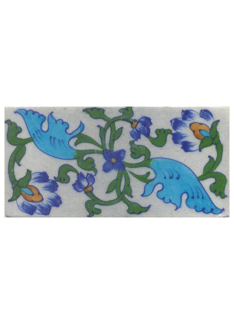 turquoise blue and green design on white tile