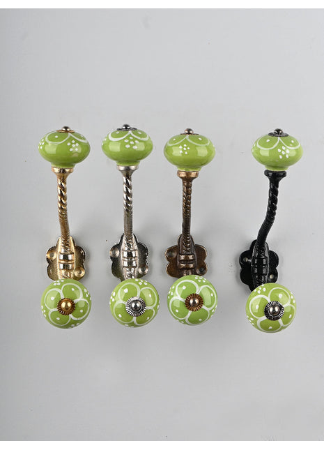 White Flower Design on Green Base Knob With Metal Wall Hanger