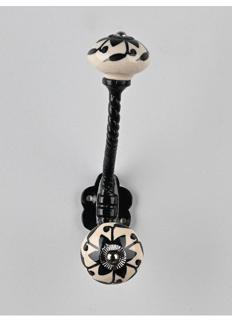 Round Black Flower Design on Off white Knob With Metal Wall Hanger