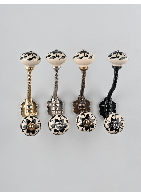 Round Black Flower Design on Off white Knob With Metal Wall Hanger