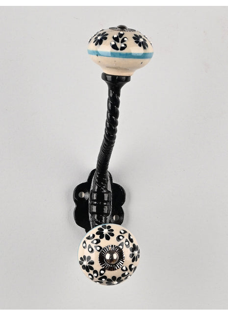 Round Black Flower Design on Off white Knob With Metal Wall Hanger