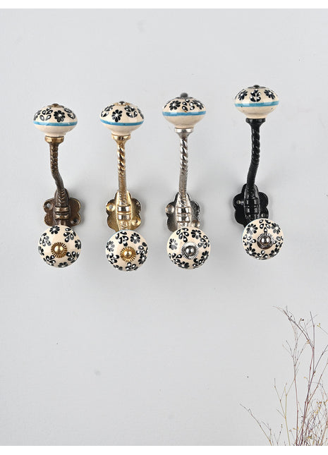Round Black Flower Design on Off white Knob With Metal Wall Hanger