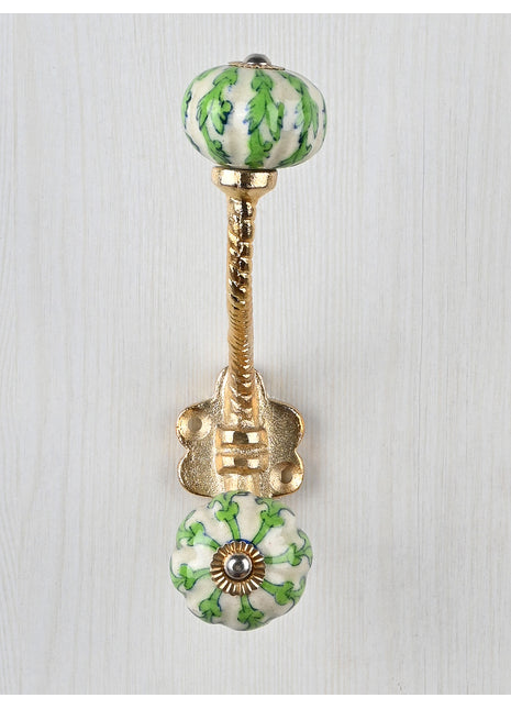 Green Leaves On White Melon Shaped Knob With Metal Wall Hanger