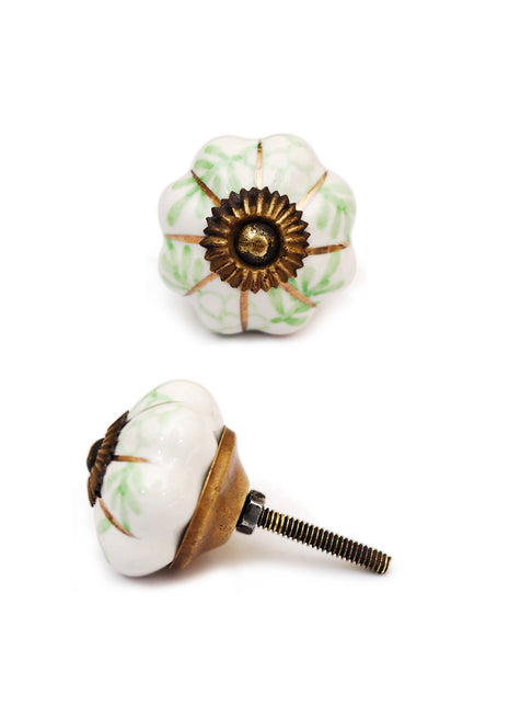 Elegant White Kitchen Cabinet Knob With Golden And Green Design