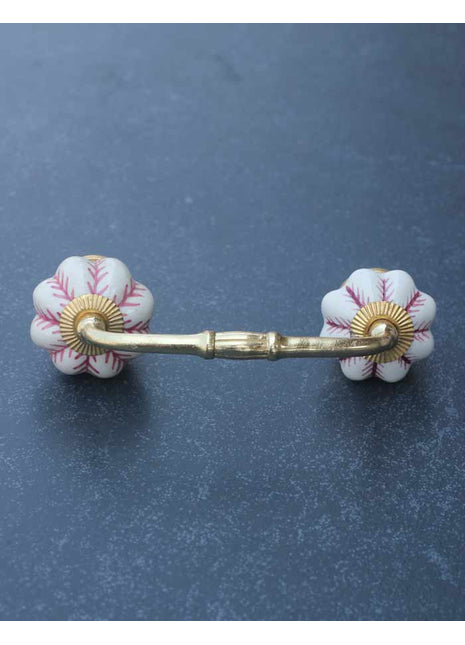 Flower Shaped White Ceramic Pull With Maroon Design