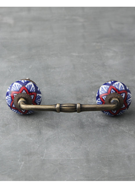 Elegant White Ceramic Cabinet Pull With Red And Blue Print