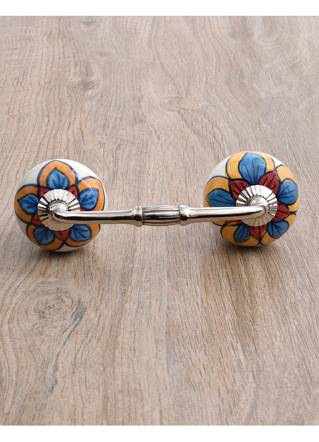 Stylish White Drawer Cabinet Pull With Red, Turquoise and Yellow Colored Flower