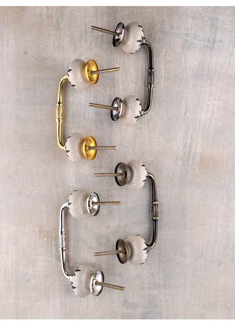 White Ceramic Bathroom Cabinet Pull With Black Petal Stem Design