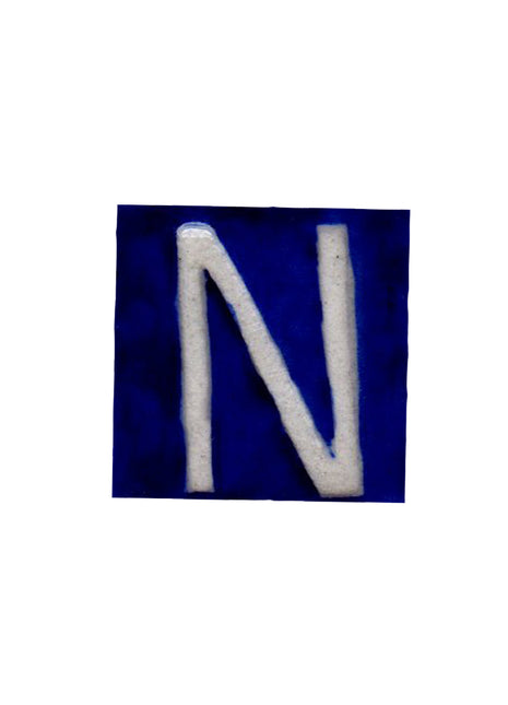 White N alphabet blue tile (2x2)