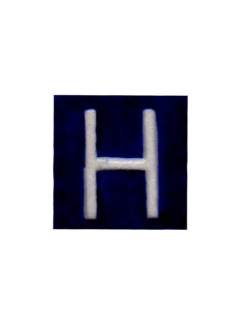 White H alphabet blue tile (2x2)