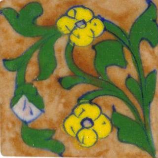 brown tile with green leaves and yellow flower
