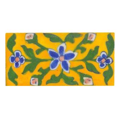 yellow tile painted with blue, pink green design 2x4