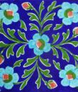 Turquoise Flowers With Green Leaves On Blue Base Tile