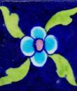 Single Turoise Flower With Green Leaves Design On Blue Tile