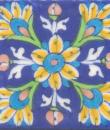 Yellow, turquoise, brown and green flowers on blue tile